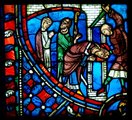 Szent Nikáz reimsi érsek vandálok általi meggyilkolása a soissons-i katedrális ólmozott ablaküvegén. A vandálok az 5. század elején törtek be Galliába, és két éven át fosztogatták a provinciát.